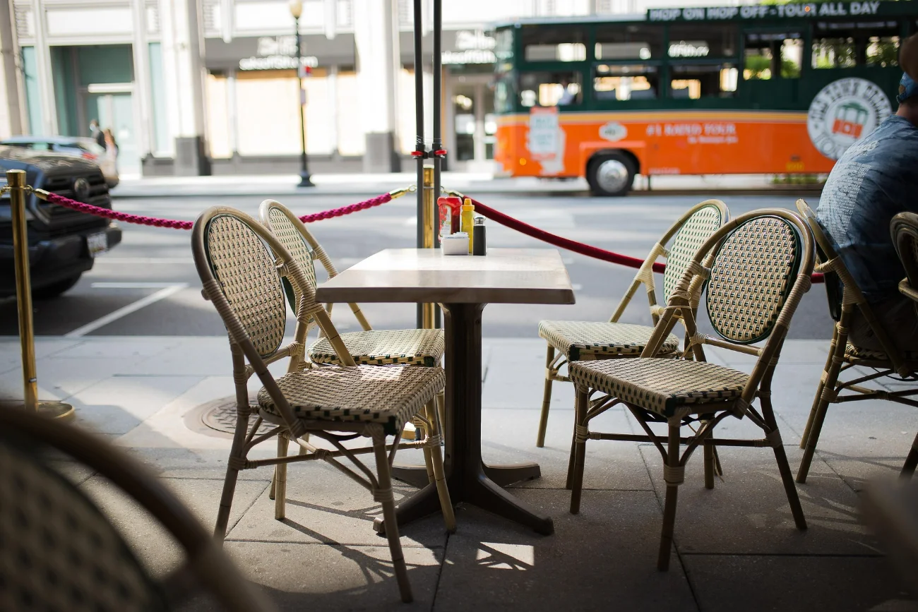 Intimate interior of a small neighborhood café with just a few tables — the foundational moment before it became famous